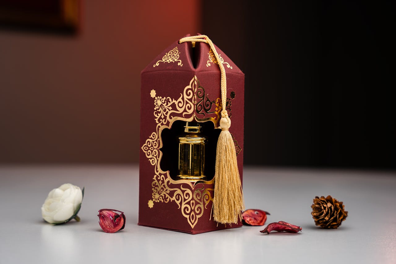 Crafting Captivating Headlines: Your awesome post title goes here Elegant lantern in ornate packaging with tassel, surrounded by dried flowers on a table.